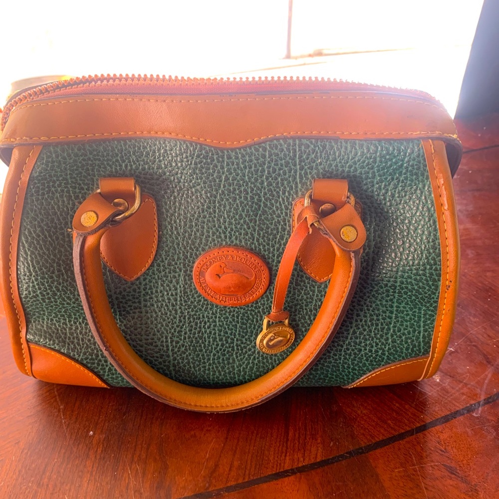This is a vintage medium/large bag. It’s been in my storage. Dooney and Bourke